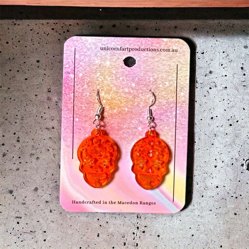 Acrylic handmade earrings  -  Orange Skulls - Unicorn Fart Productions